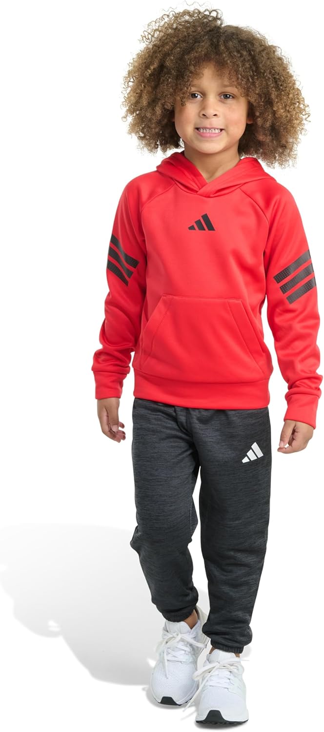 Boy wearing Adidas Pure Ruby hoodie and jogger pants during outdoor play